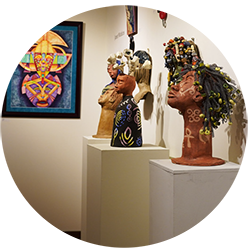 Different types of artwork on display in a gallery