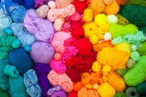 Collection of colorful spools of yarn