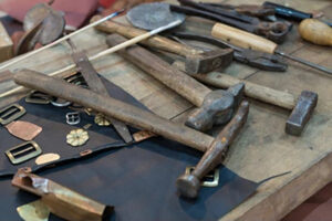 Table filled with a variety of metalsmithing tools