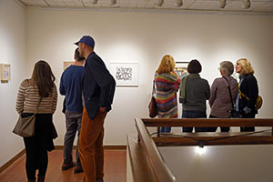 People in the gallery at Sweetwater looking at artwork